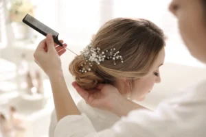 10 Wedding Hairstyle Ideas for Your Special Day / Floral Boho Waves / Vintage Waves / Messy Bun with Soft Tendrils / Textured Updo / Sleek and Straight / Chic Braided Crown / Half-Up, Half-Down / Romantic French Twist / Loose Waves with a Side Part / Classic Low Bun / Choosing the Perfect Wedding Hairstyle for Your Big Day / Ciao Bella Salon Spa Islamorada Florida / Bridal Services