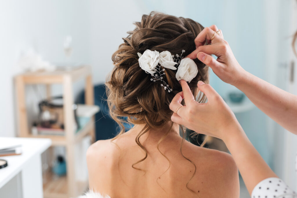 10 Wedding Hairstyle Ideas for Your Special Day 2 10 Wedding Hairstyle Ideas for Your Special Day / Floral Boho Waves / Vintage Waves / Messy Bun with Soft Tendrils / Textured Updo / Sleek and Straight / Chic Braided Crown / Half-Up, Half-Down / Romantic French Twist / Loose Waves with a Side Part / Classic Low Bun / Choosing the Perfect Wedding Hairstyle for Your Big Day / Ciao Bella Salon Spa Islamorada Florida / Bridal Services