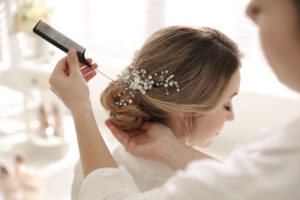 10 Wedding Hairstyle Ideas for Your Special Day / Floral Boho Waves / Vintage Waves / Messy Bun with Soft Tendrils / Textured Updo / Sleek and Straight / Chic Braided Crown / Half-Up, Half-Down / Romantic French Twist / Loose Waves with a Side Part / Classic Low Bun / Choosing the Perfect Wedding Hairstyle for Your Big Day / Ciao Bella Salon Spa Islamorada Florida / Bridal Services