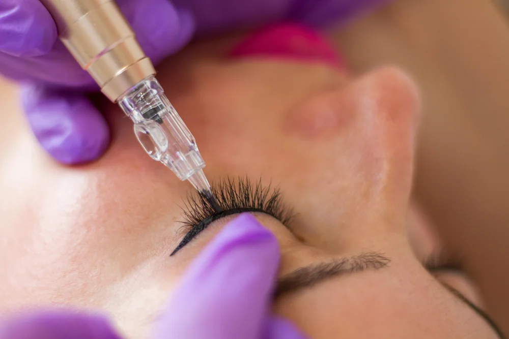 Permanent Eyeliner - The Ultimate Guide To A Beautiful, Effortless Look 2 Young woman with a permanent make-up eyeliner in a beauty salon / Permanent Eyeliner - The Ultimate Guide To A Beautiful, Effortless Look / What Is Permanent Eyeliner? / Why Should You Consider Permanent Eyeliner? / The Permanent Eyeliner Procedure: What to Expect / Benefits of Permanent Eyeliner / Long-Lasting Results / Enhance Your Natural Beauty / How to Choose the Right Technician for Permanent Eyeliner / FAQs About Permanent Eyeliner / Ciao Bella Salon and Spa in Islamorada Florida