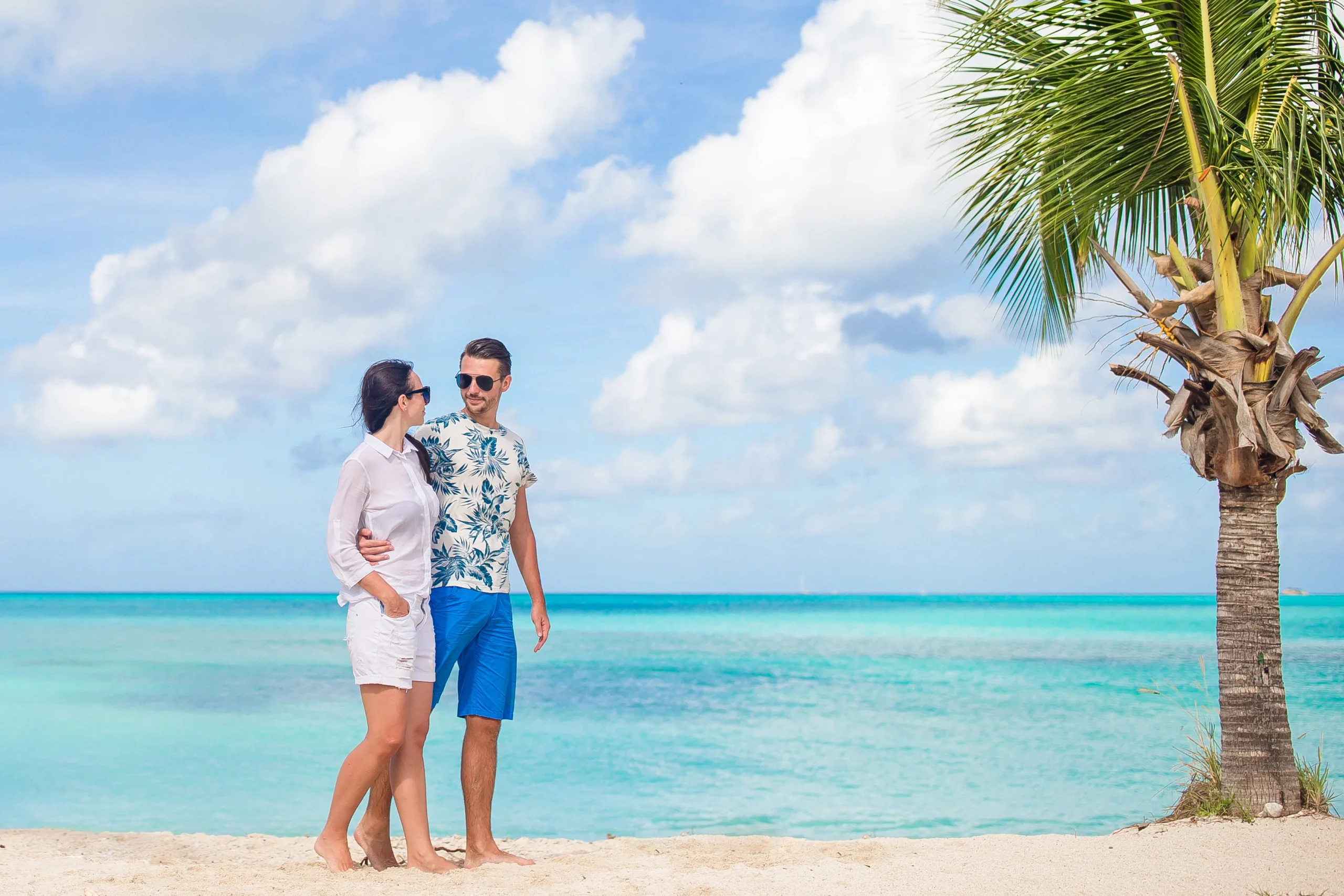 Lovely couple walking on the beach and enjoying summer vacation - Honeymoon in the Florida Keys: The Ultimate Relaxation Experience for Newlyweds - Ciao Bella Salon Spa Islamorada Florida Keys