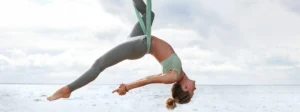 Young Blonde Woman Practicing Aerial Yoga in Silk - -A Beginner’s Guide to Aerial Yoga in Islamorada - ciao bella wellness center - Ciao Bella Salon and Spa Wellness Center