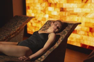 Woman enjoying halotherapy treatment in spa center salty room - Experience the Healing Powers of Salt Therapy at Ciao Bella, Florida Keys - Ciao Bella Salon Spa Islamorada