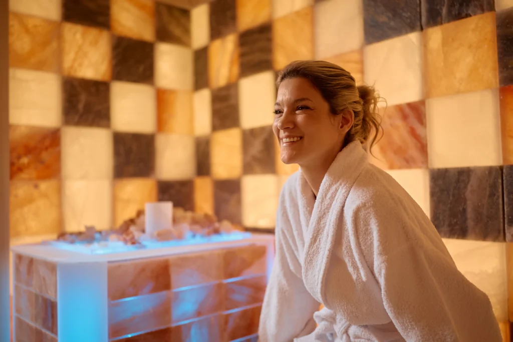 Happy woman during halotherapy treatment at health spa. - From Stress to Stillness: Unwinding in the Florida Keys – A Spa Day at Ciao Bella