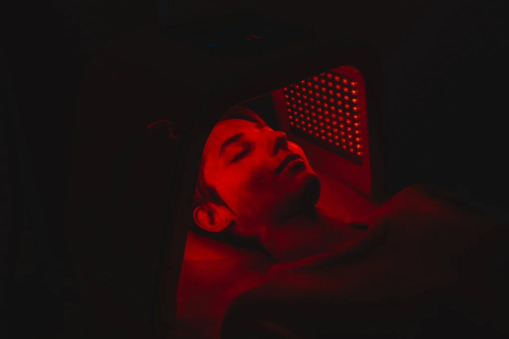 facial skin care using an led lamp in a beauty - The Longevity Gift: Why Red Light Therapy is the Ultimate Mother’s Day Self-Care - Ciao Bella Islamorada Salon Spa