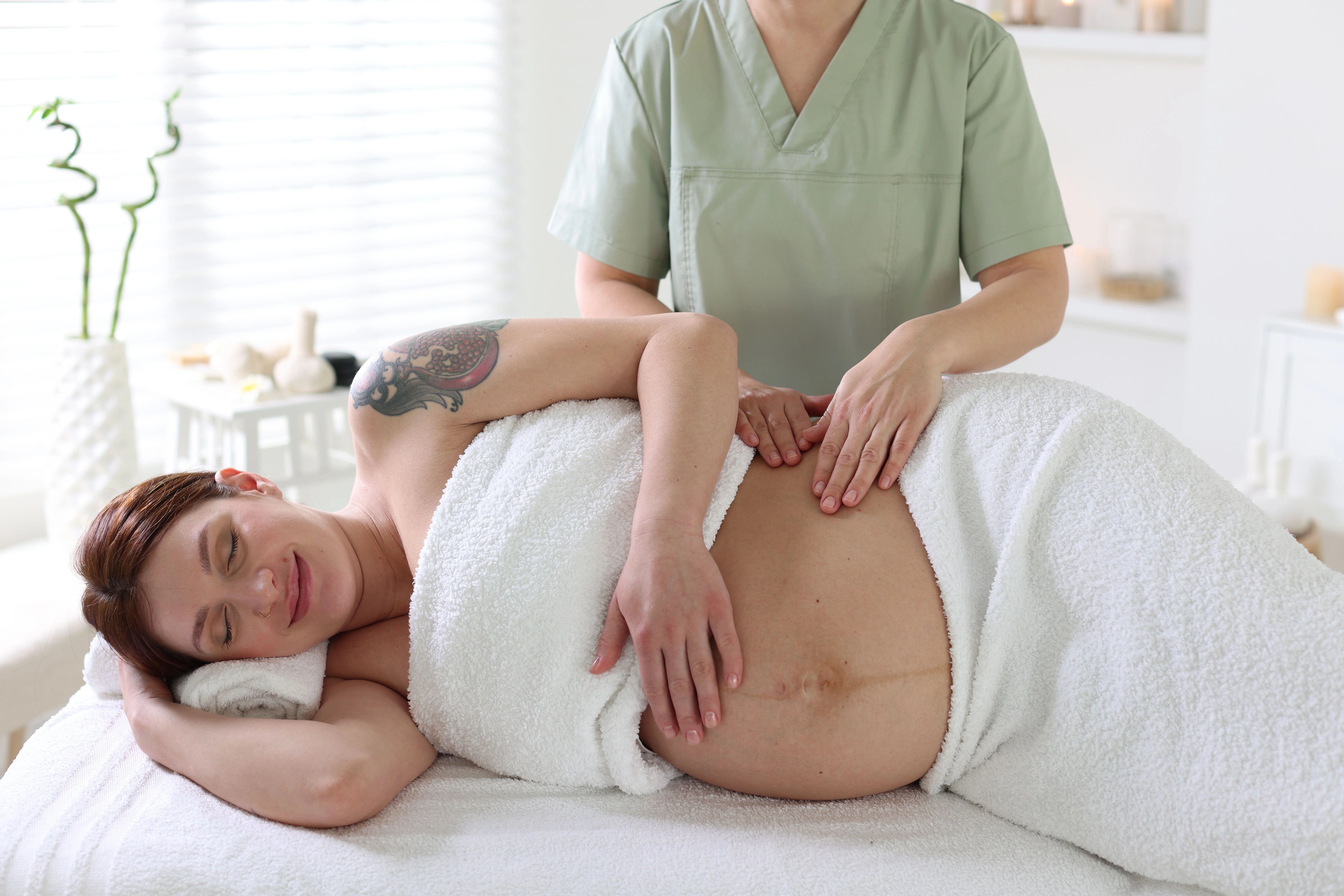 pregnant woman receiving relaxing massage in spa - Mommy on Board: Prenatal Massages for Relaxation and Wellness in the Florida Keys - Ciao Bella Spa Islamorada