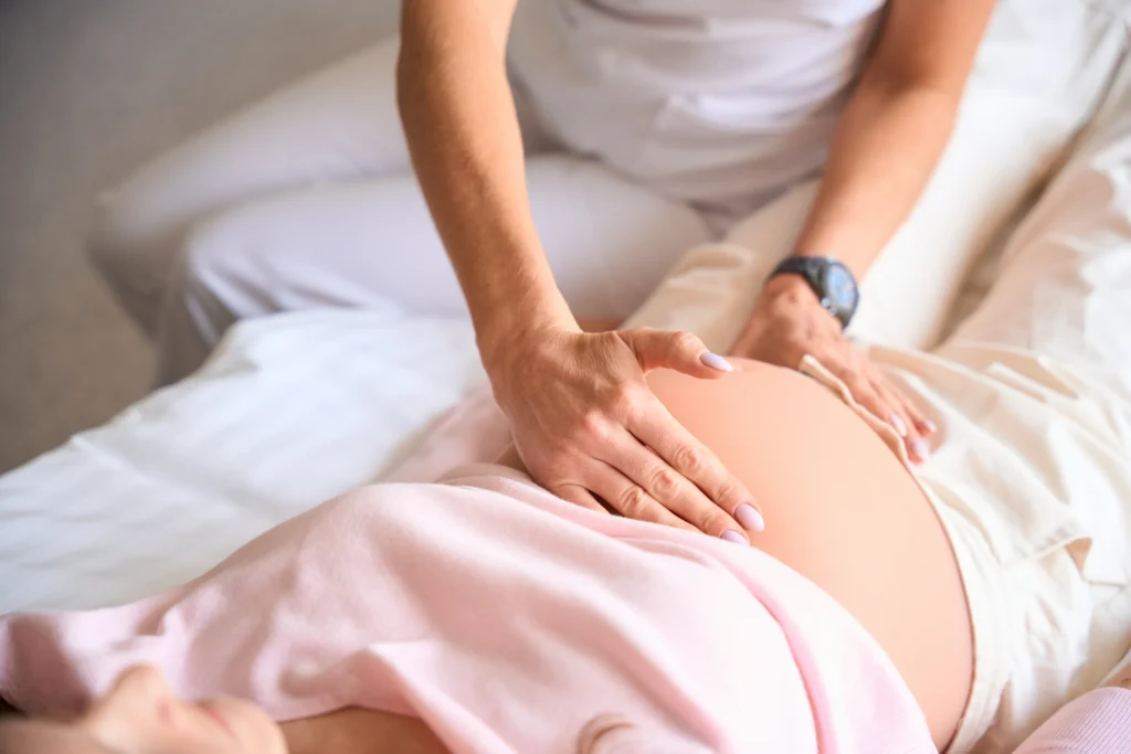 unrecognizable female doctor examining pregnant - Mommy on Board: Prenatal Massages for Relaxation and Wellness in the Florida Keys - Ciao Bella Spa Islamorada