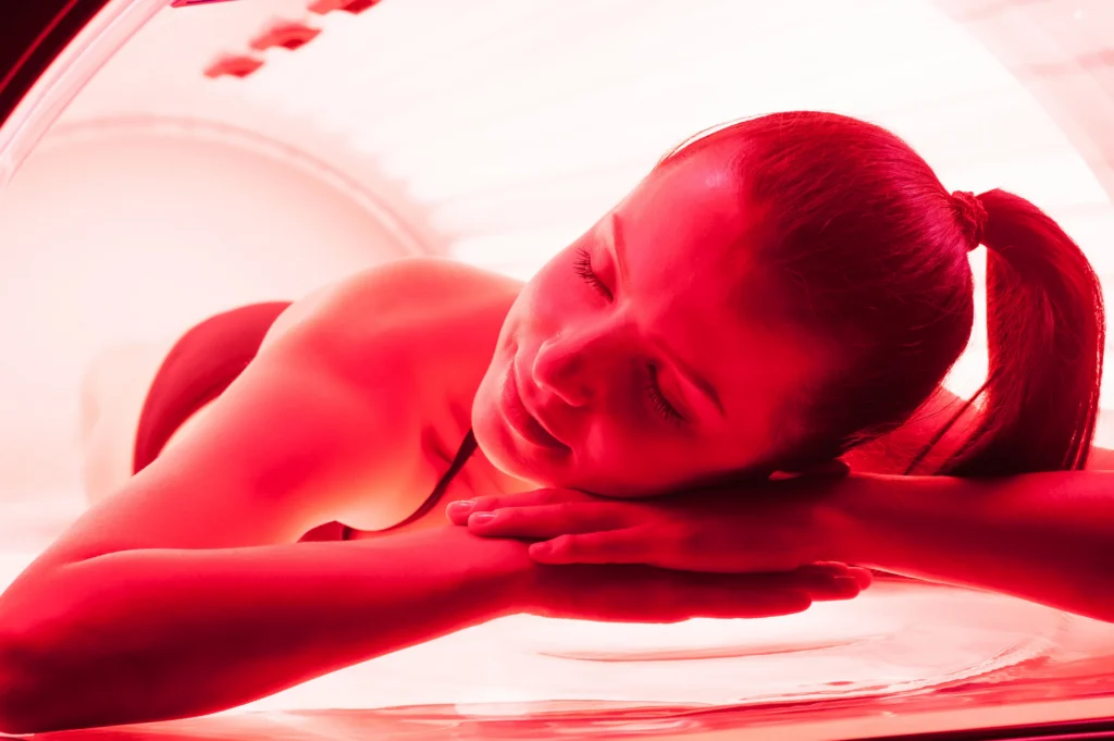 facial skin care using an led lamp in a beauty - The Longevity Gift: Why Red Light Therapy is the Ultimate Mother’s Day Self-Care - Ciao Bella Islamorada Salon Spa