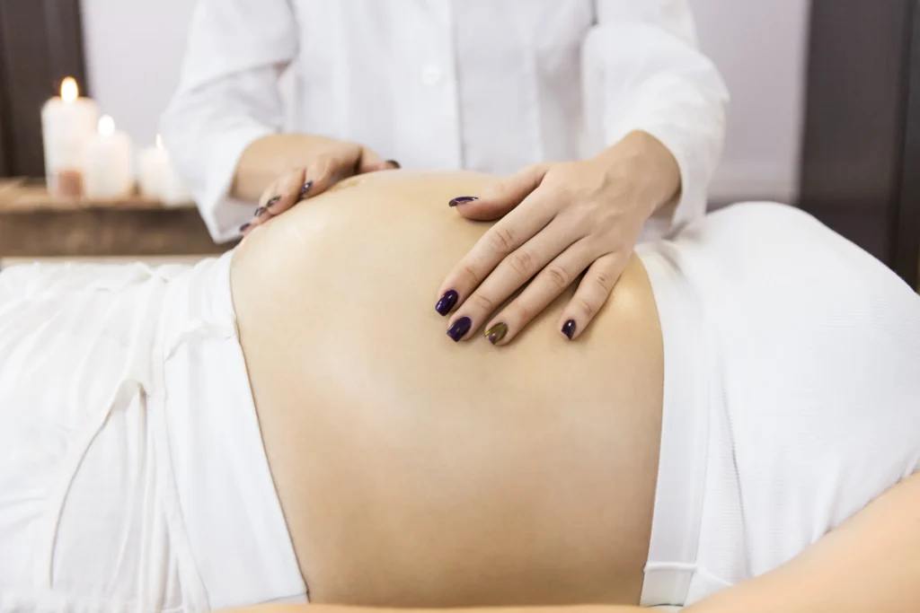 young pregnant woman have massage treatment at spa - Mommy on Board: Prenatal Massages for Relaxation and Wellness in the Florida Keys - Ciao Bella Spa Islamorada