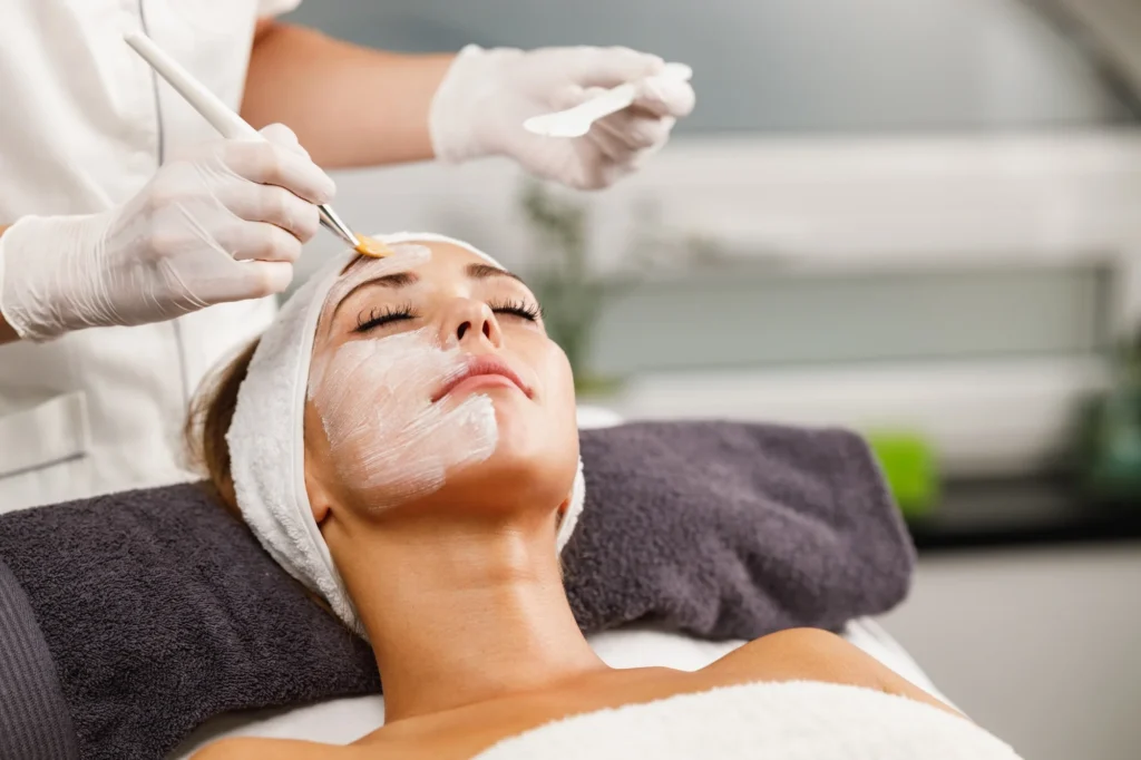 How Can You Boost Collagen Naturally? Your Complete Guide to Healthier, Firmer Skin 2 relaxing woman receiving a facial at spa - How Can You Boost Collagen Naturally? Your Complete Guide to Healthier, Firmer Skin