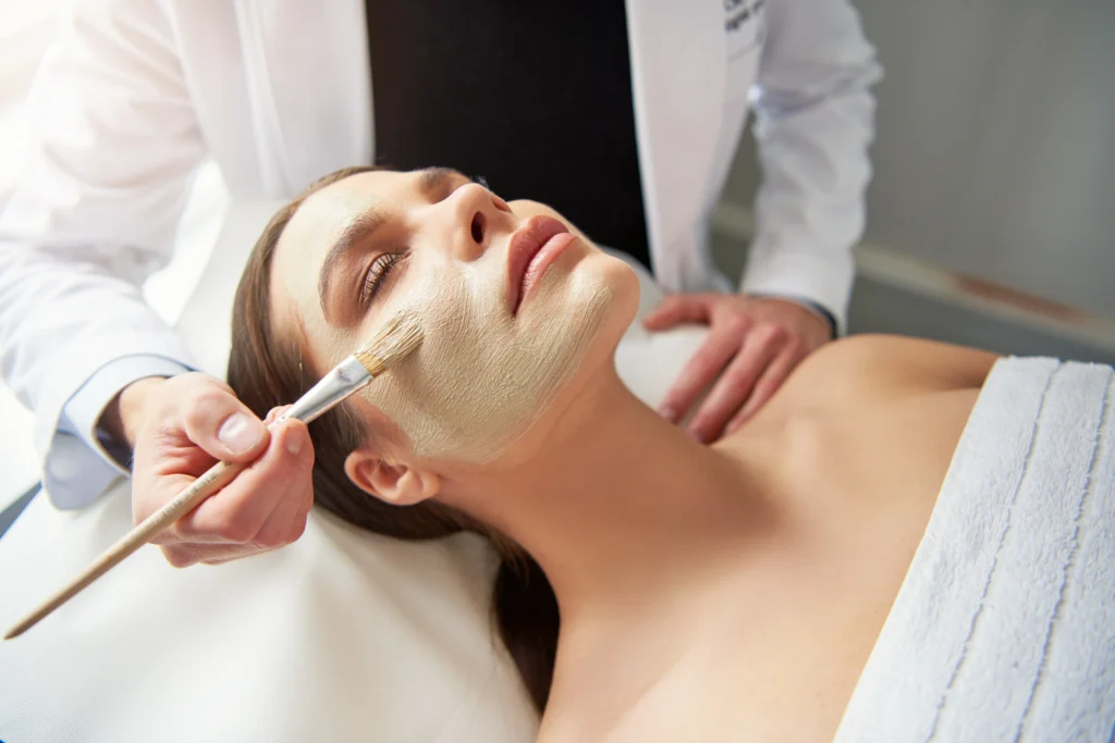 woman receiving facial spa treatment in ciao bella spa - How Can Clinical Skin Services Help Treat Congested Summer Skin in Islamorada?