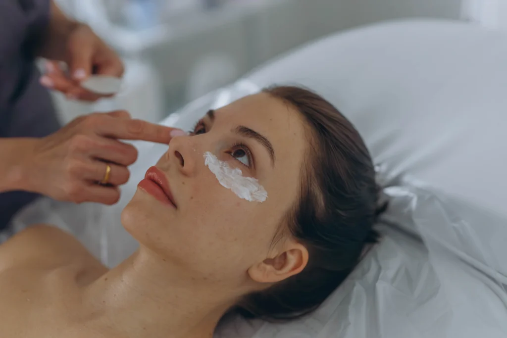 woman relaxing while receiving a facial treatment - How Can Clinical Skin Services Help Treat Congested Summer Skin in Islamorada?