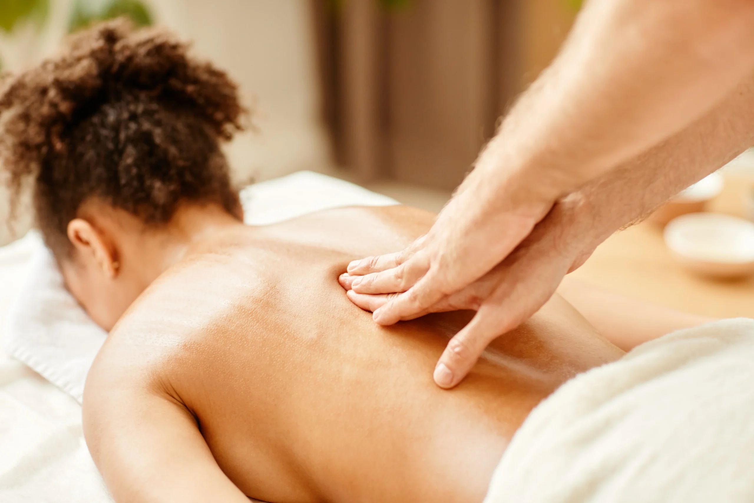 relaxing massage therapy session at spa indoors